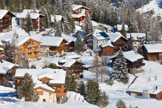 Switzerland, Arosa, view of chalet houses in snow