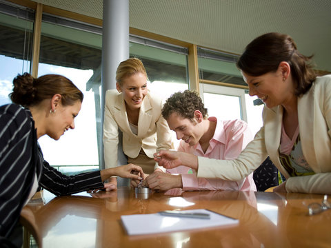Young professionals assembling magnetic balls