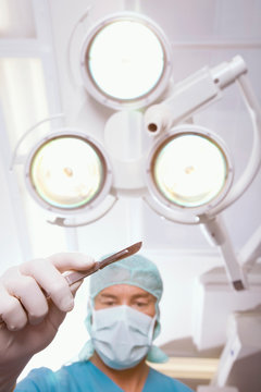 Surgeon with scalpel