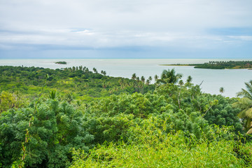 A view of the Atlantic Forest and Atlantic Ocean from the viewpoint in Vila Velha on a rainy day - Itamaraca Island, Brazil