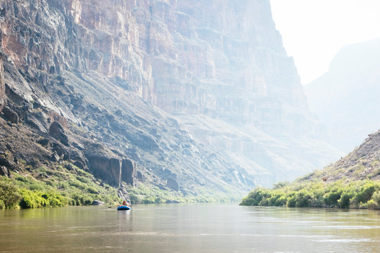 Two people in a raft on a calm stretch above Lava Rapid, Grand Canyon National Park, Arizona, USA