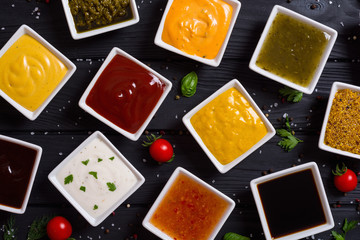 Set of different sauces in ceramic bowl