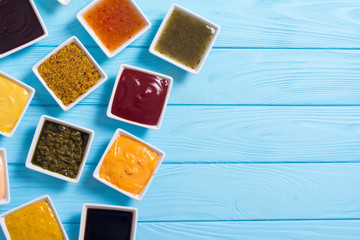 Set of different sauces in ceramic bowl
