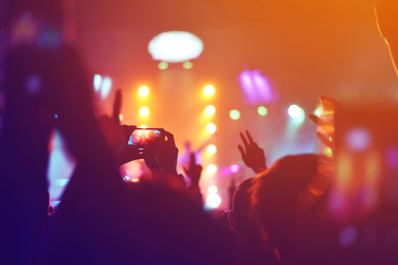 Fototapeta premium silhouettes of , Fun concert party rock disco light background.