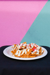 Mexican style food dish served with a colourful background