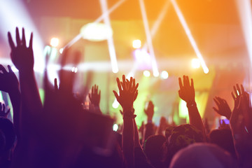 silhouettes of  , Fun concert party rock disco light background.