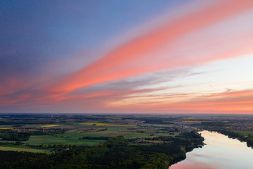 Aerial drone photography of a lake landscape during sunset. Beautiful and calm rural landscape. 