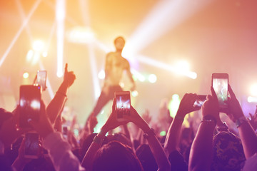 silhouettes of  , Fun concert party rock disco light background.