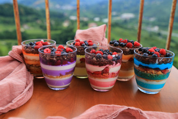 Blueberry,strawberry and raspberry Magnolia Dessert on the wooden table for concept.