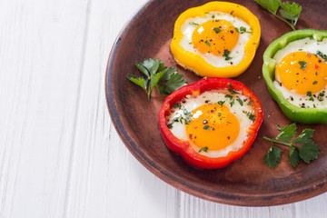 Yellow , red and green pepper with fried eggs