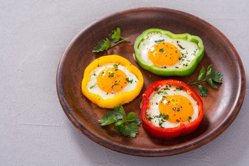 Yellow , red and green pepper with fried eggs