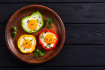 Yellow , red and green pepper with fried eggs