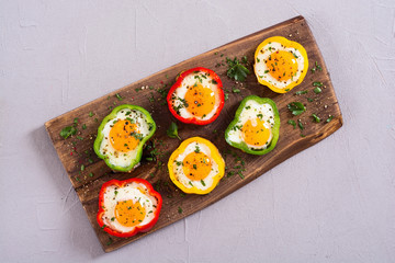 Yellow , red and green pepper with fried eggs