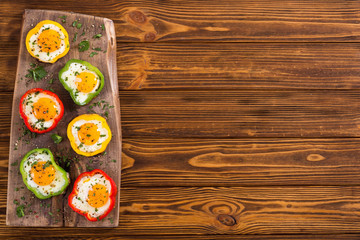 Yellow , red and green pepper with fried eggs