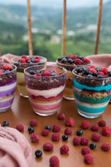 Blueberry,strawberry and raspberry Magnolia Dessert on the wooden table for concept.