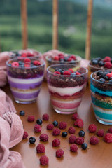 Blueberry,strawberry and raspberry Magnolia Dessert on the wooden table for concept.