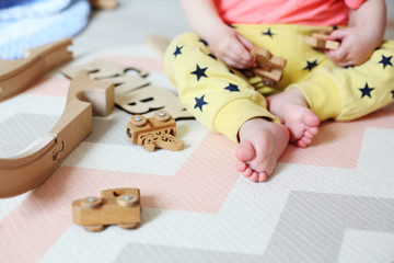 little boy with wooden toys