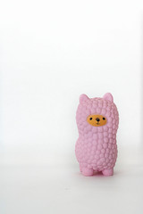 Pink small llama squishy on white empty background. Vertical with copy space. Isolate. Soft toy for kids, antistress.