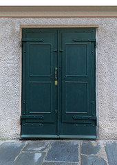 Closed green wooden door