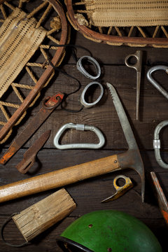 Old mountaineering equipment on a wood table