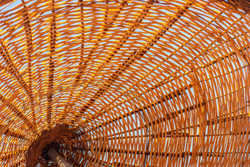 Bamboo beach umbrella with blue sky. Pattern close up