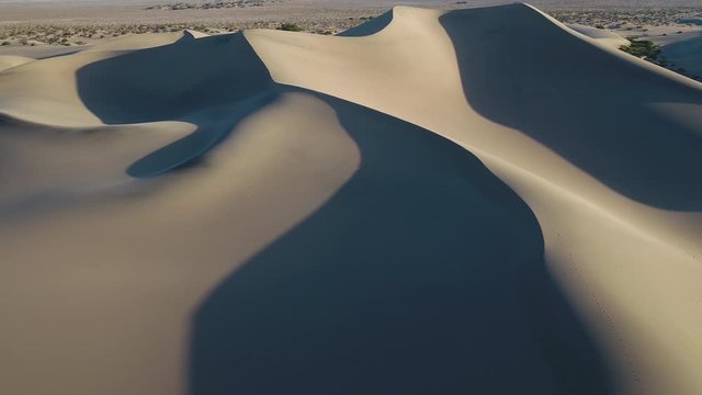 Aerial California Death Valley May 2019 Sunny Day 30mm 4K Inspire 2  Aerial video of Mesquite Flat sand dunes in Death Valley National Park on a beautiful sunny day.
