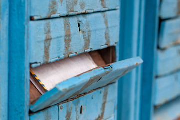 A letter in an old mailbox on the street