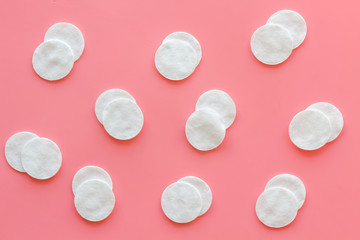 Hygiene cotton pads for pattern on pink background top view