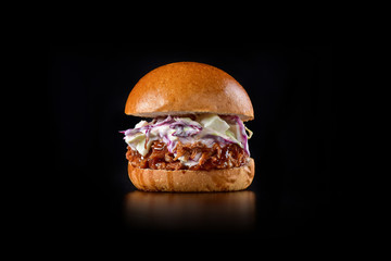 Pulled pork sandwich on rustic decorated scene