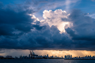 Dramatic sunset view of the city skyline on the edge of Biscayne Bay in Miami, Florida, USA
