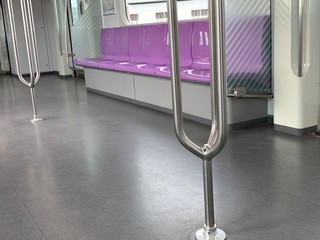 empty violet color seats in Sky train in Thailand
