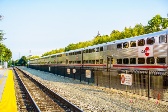 August 21, 2018 Palo Alto / CA / USA - Caltrain (local train going through Silicon Valley) leaving a station in south San Francisco bay area