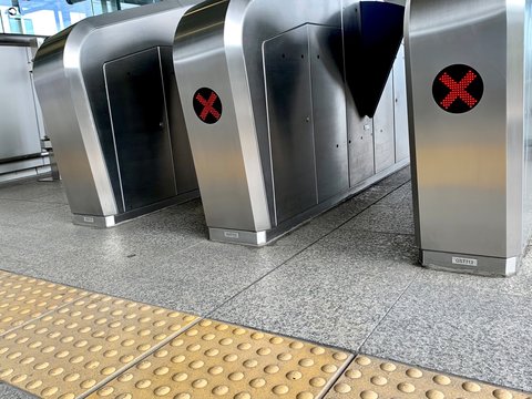 Automatic barriers for control people entered in railway station or in metro, red light show for no entrance, necessary tickets, new technologies in habitual life, automatic open and close doors