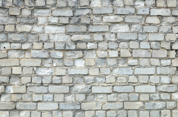 Old weathered white brick wall