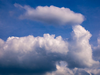 Naklejka na ściany i meble Beautiful dense clouds in the blue sky