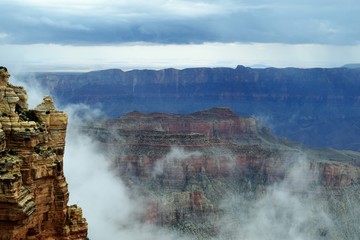 Fog Sets in at North Rim of Grand Canyon's Gorge Highlighting Formations