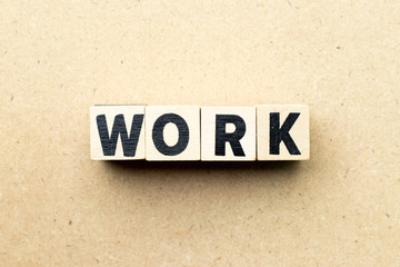 Obraz premium Letter block in word work on wood background