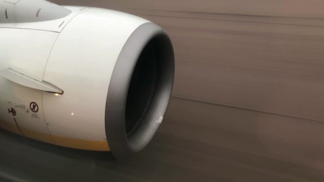 Airplane turbine side view close up during take off