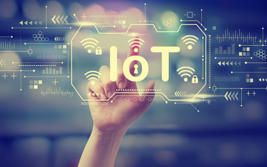 IoT theme with hand pressing a button at night