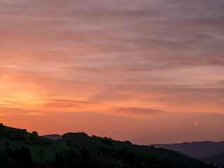 A few moments before sunrise on the dark cloudy skies