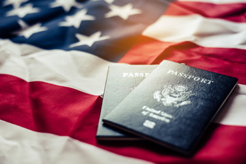 Passport is placed on the US flag. Preparing for a legitimate journey © photobyphotoboy