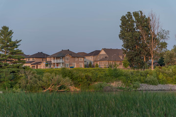 Houses between green fields in Ottawa, Canada