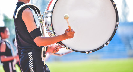 Close-up of marching band drummers marching