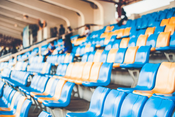Fototapeta premium Rows of plastic seats on a grandstand, chair in a stadium, sitting area for spectator