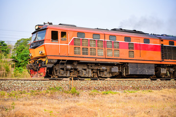 Fototapeta na wymiar Old Thai-style trains that can still pick-up passengers on the train tracks