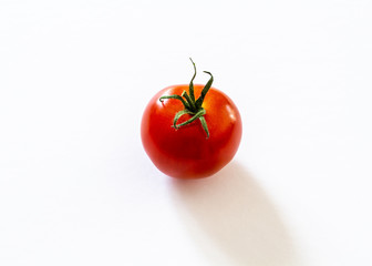 small red cherry tomato on white background