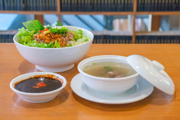 Vietnamese cuisine noodle soup with fresh vegetable and herbs