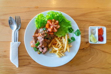Directly above view of stir fried beef on white plate 