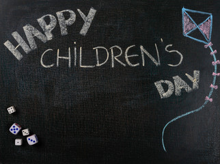 Drawing on sandpaper. Happy Children's day and game dice. Copy space.