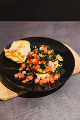 vegan burger recipe with diced tomato and charred kale